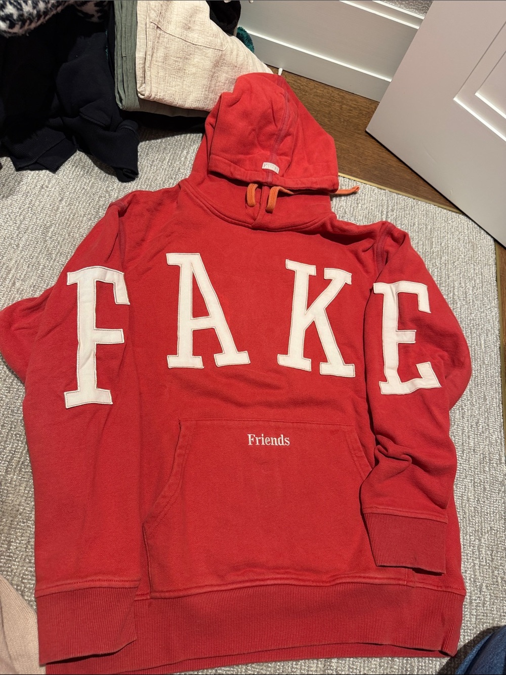 Kith Red 'FAKE' Crewneck Hoodie with White Lettering